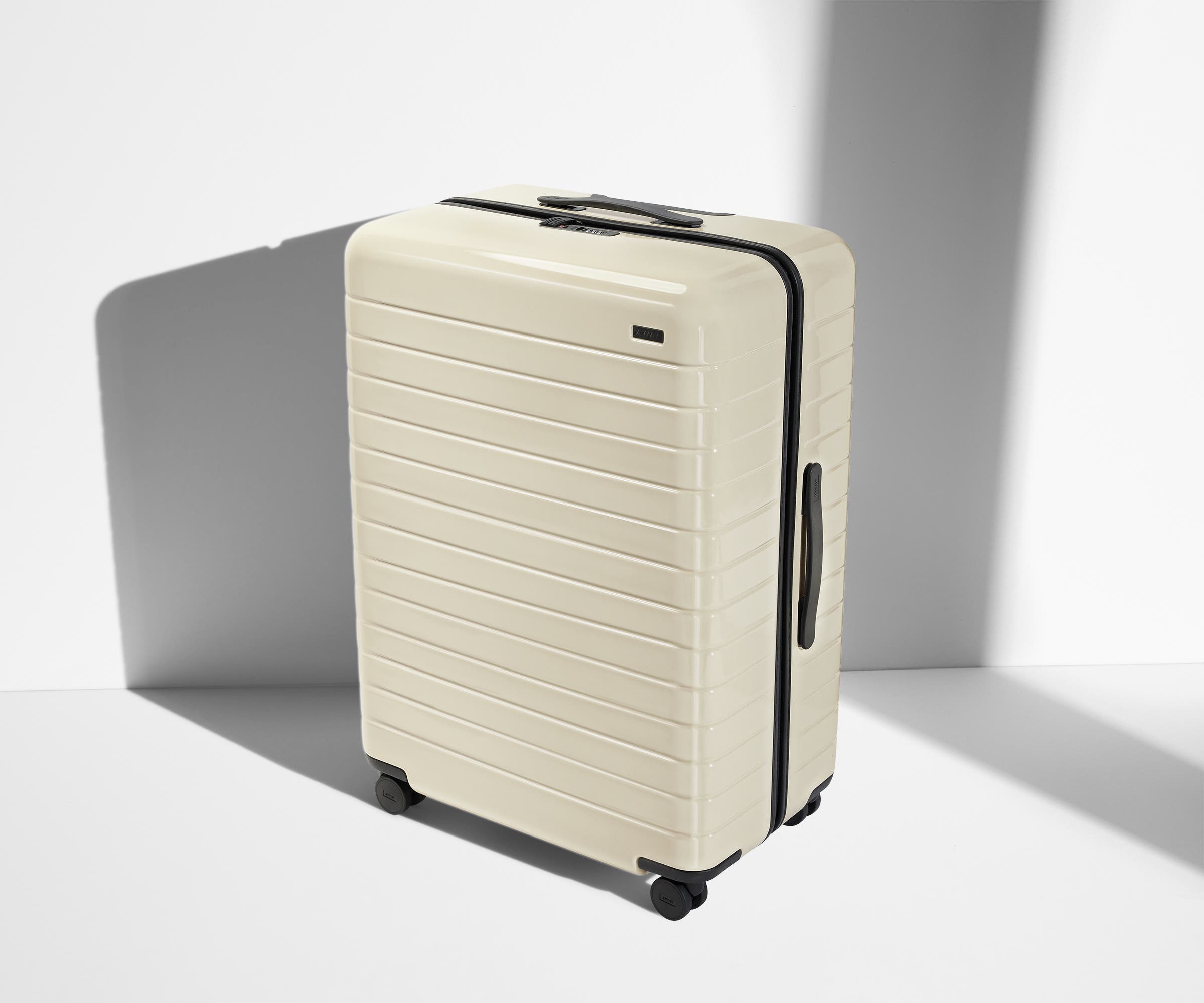 Angled product view of The Large suitcase in Salt White (Gloss)