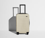 Front product view of The Carry-On suitcase in Coast Blue with raised handle