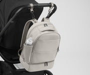 Backpack attached to a stroller using the included stroller clips