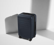 Angled product view of The Carry-On suitcase in Navy Blue