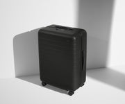 Angled product view of The Medium suitcase in Jet Black