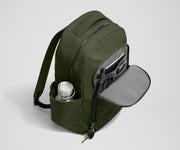 Front exterior zip pocket, detachable key clip, and exterior water bottle pocket of The Commuter Backpack