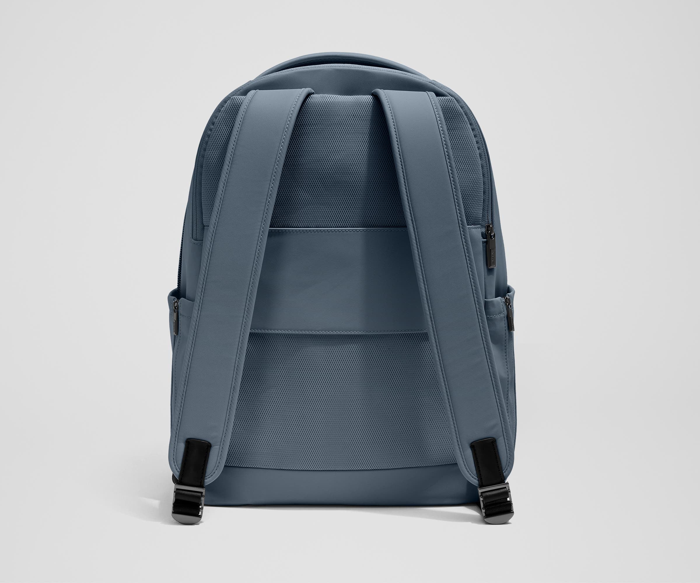 The Commuter Backpack back view showing padded shoulder straps and trolley sleeve feature