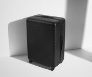 Angled product view of The Large suitcase in Jet Black