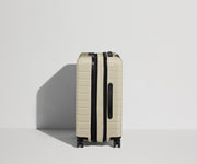 Side product view of The Carry-On Flex suitcase in Salt White (Gloss) shown fully expanded