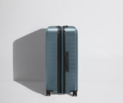 Side product view of The Large Flex suitcase shown fully expanded