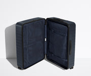 The Large suitcase in Navy Blue shown open in an upright position to show interior organization and compression system