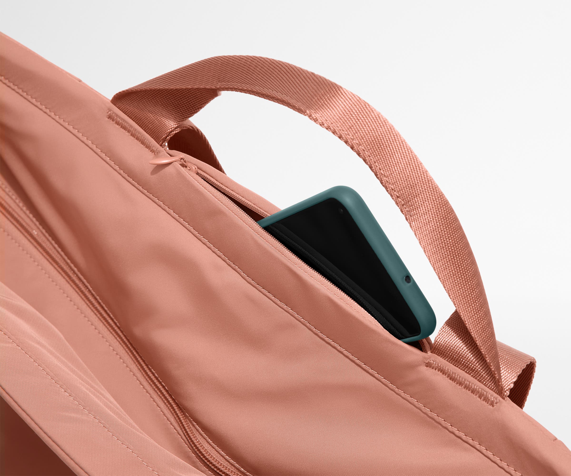 Phone shown in the hidden pocket between handles