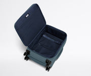 Open, unpacked Softside Bigger Carry-On, showing the depth of the bag and signature compression pad feature