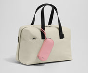 Sunglasses pouch attached to the Everywhere Bag strap