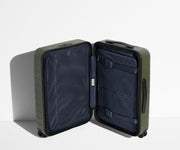 The Carry-On suitcase in Olive Green shown open in an upright position to show interior organization and compression system