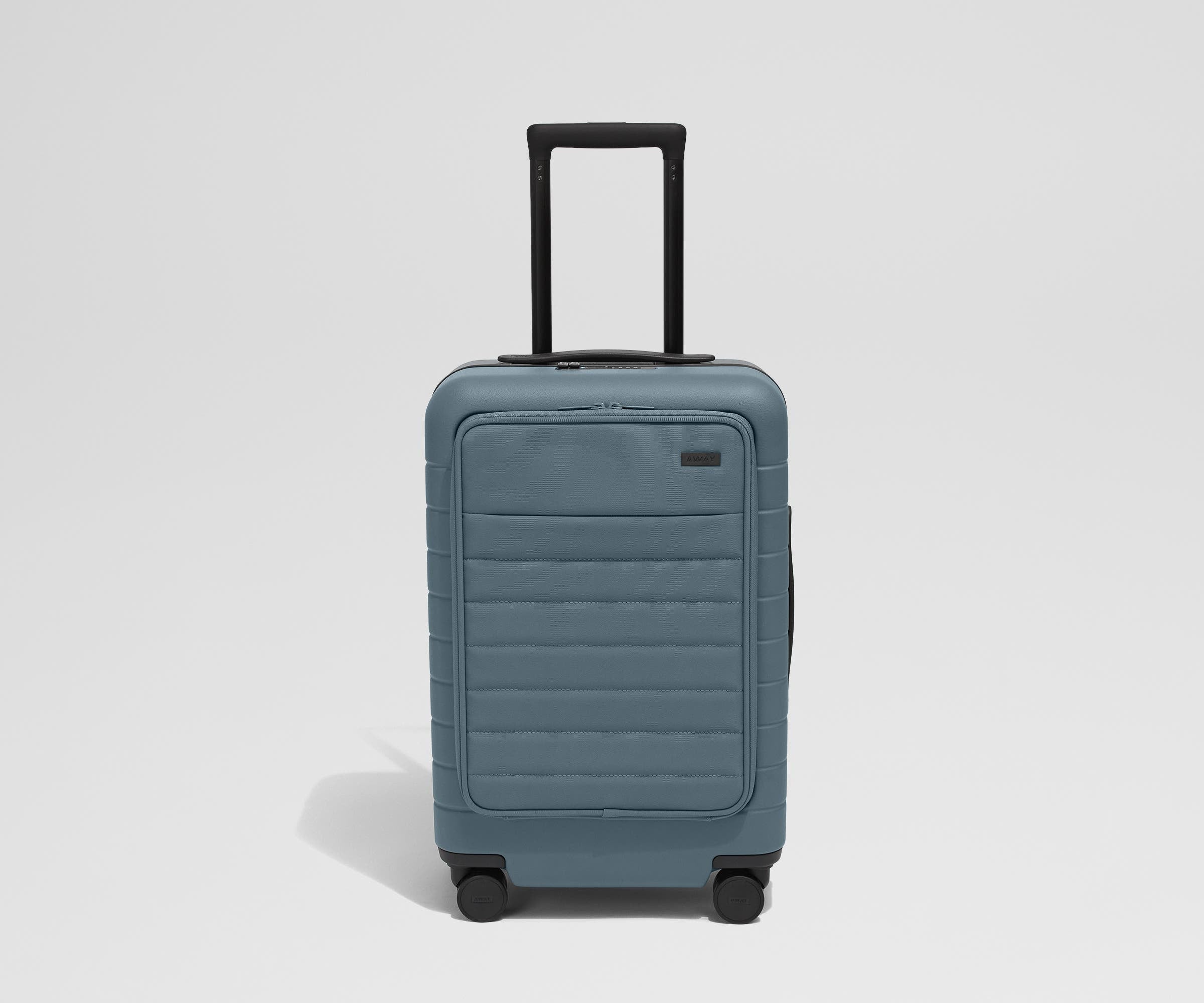 Front product view of The Front Carry-On suitcase in Coast Blue with raised handle
