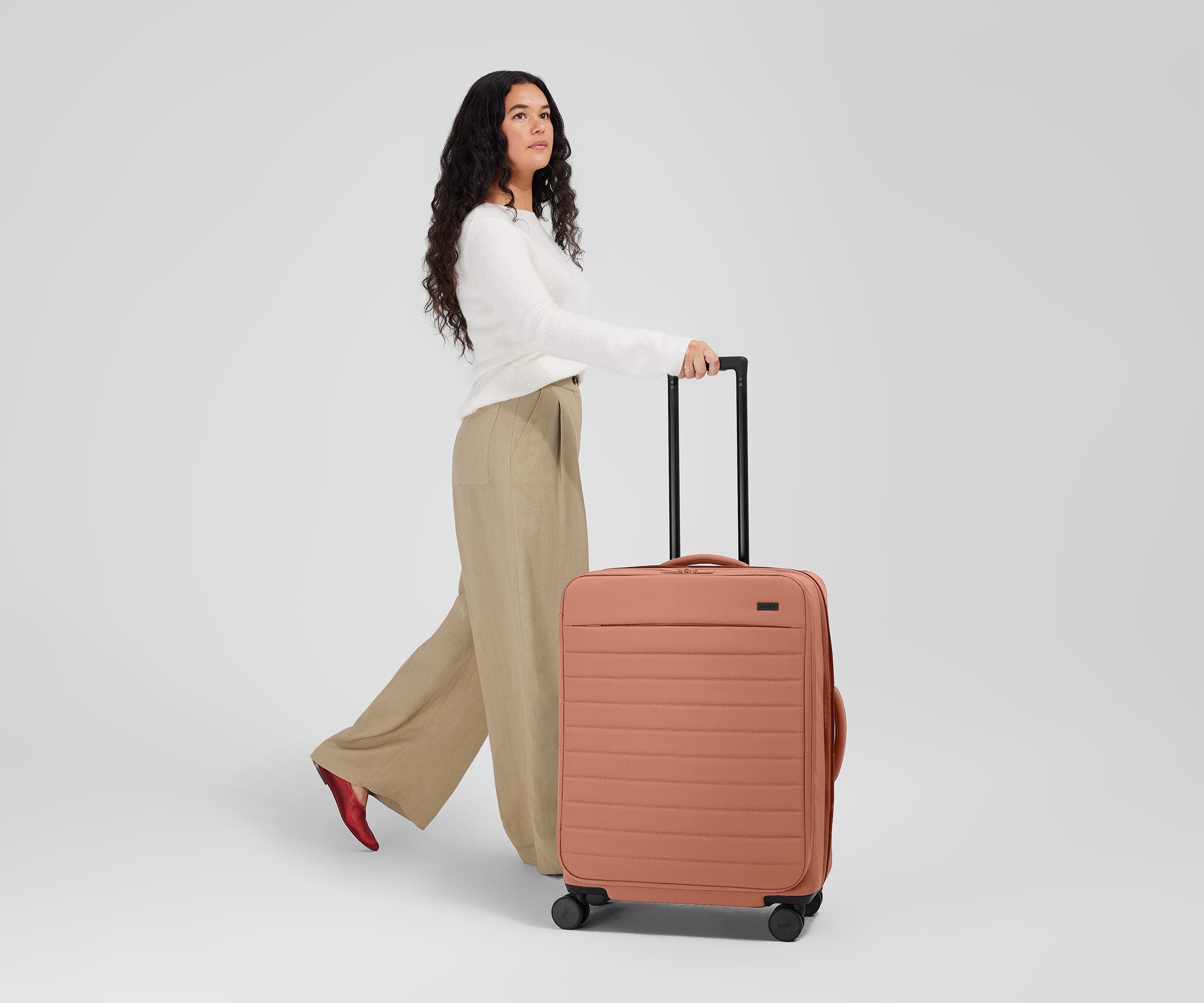 5'7" standing next to the Softside Medium for scale