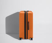 Side product view of The Large Flex suitcase shown fully expanded