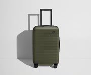 Front product view of The Carry-On Flex suitcase in Olive Green with raised handle