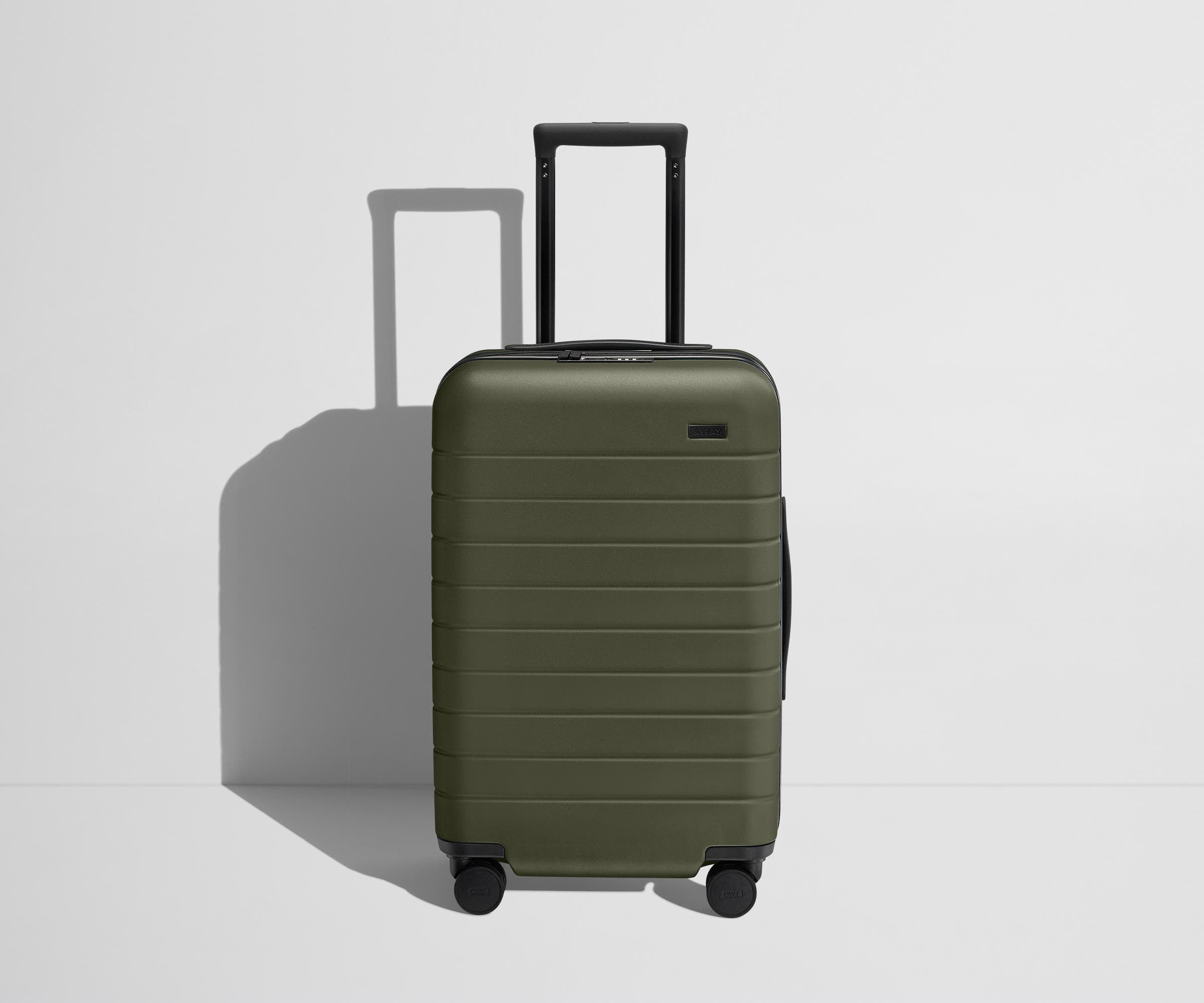 Front product view of The Carry-On Flex suitcase in Olive Green with raised handle