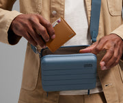 Card case being packed inside The Mini Crossbody