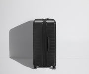 Side product view of The Large Flex suitcase shown fully expanded