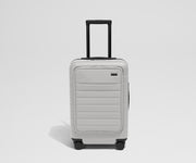 Front product view of The Front Carry-On suitcase in Cloud Gray with raised handle