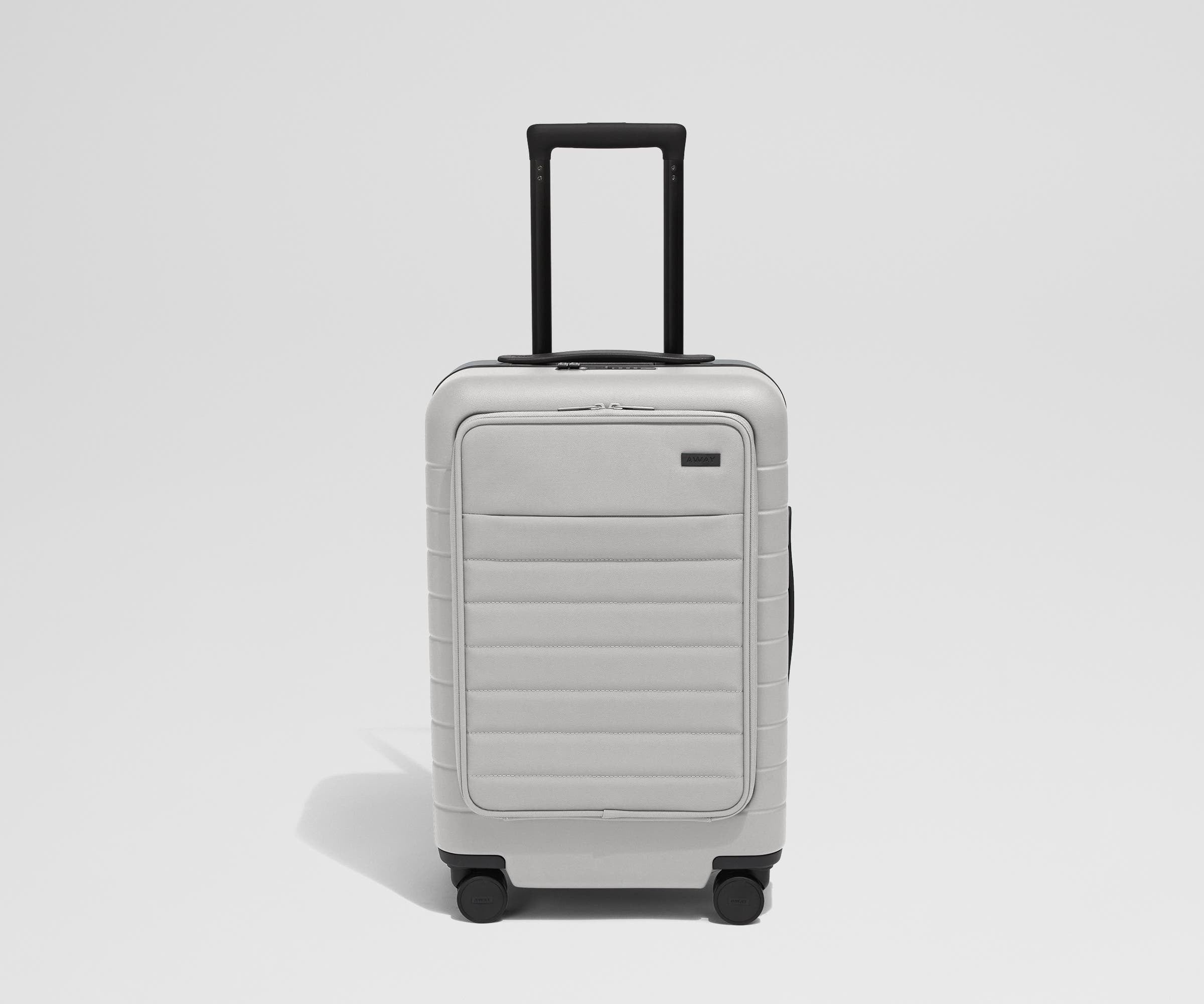 Front product view of The Front Carry-On suitcase in Cloud Gray with raised handle