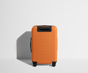 Back product view of The Carry-On suitcase in Sorbet Orange