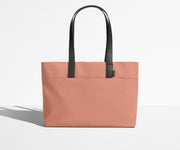 Front view of The Everywhere Tote with its leather handles up