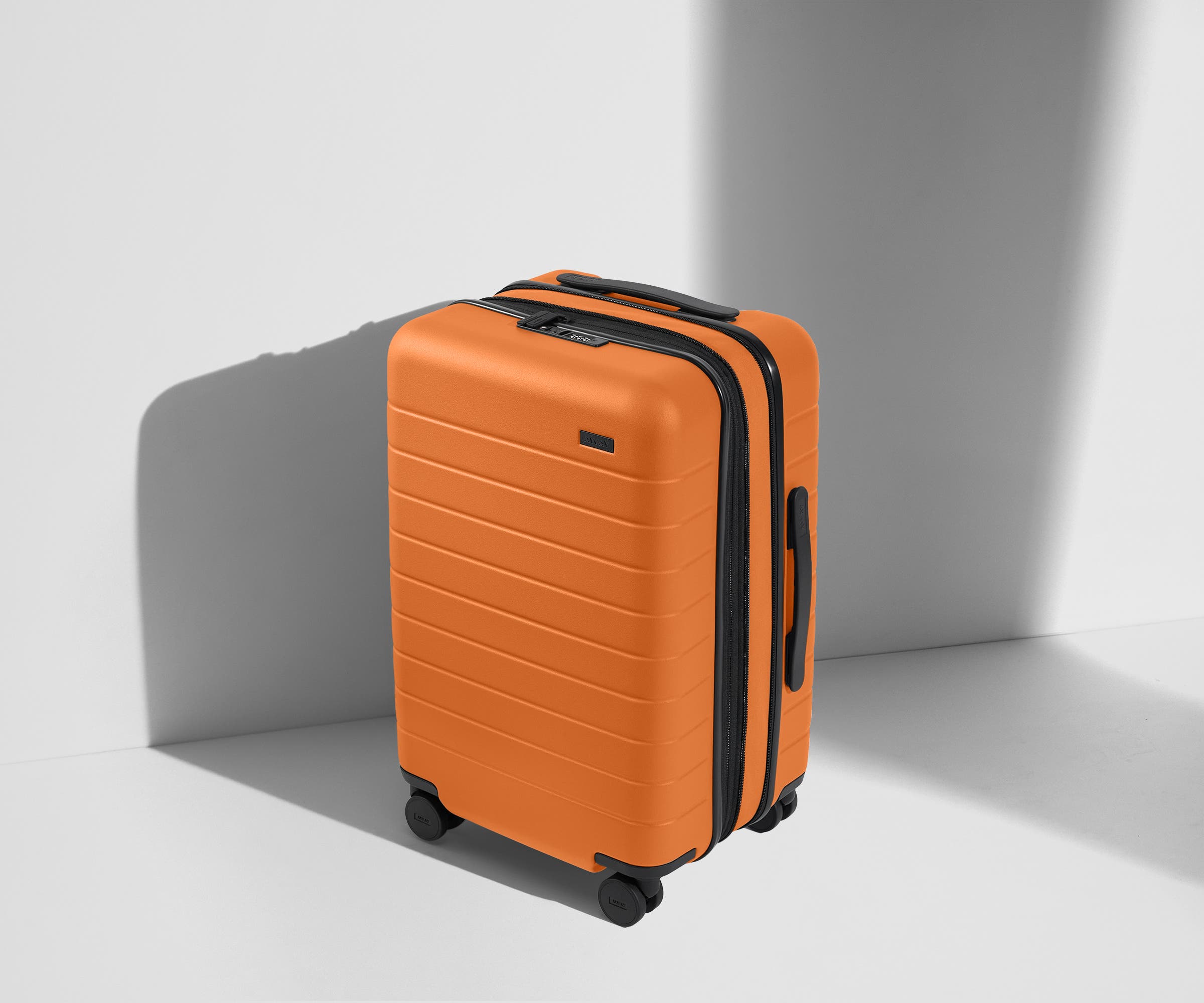 Angled product view of The Carry-On Flex suitcase in Sorbet Orange
