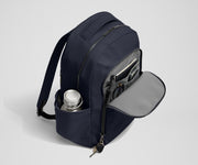 Front exterior zip pocket, detachable key clip, and exterior water bottle pocket of The Commuter Backpack