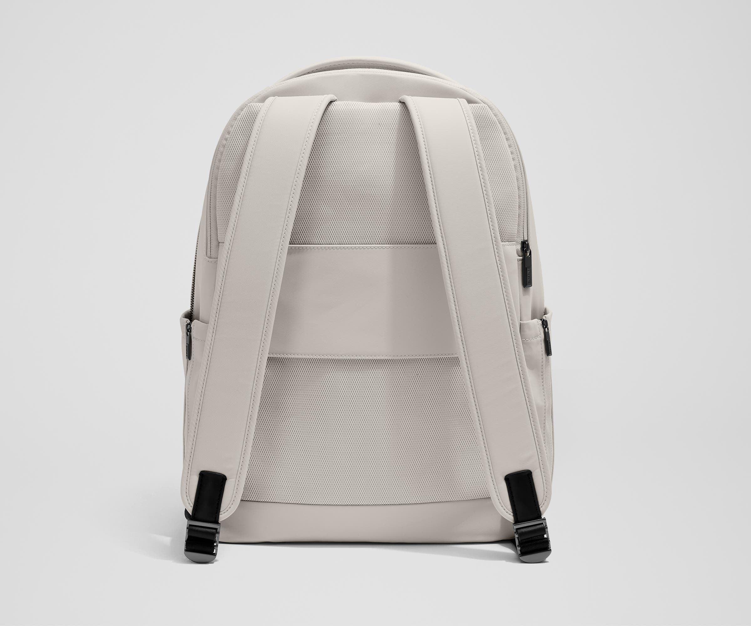 The Commuter Backpack back view showing padded shoulder straps and trolley sleeve feature