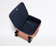 Open, unpacked Softside Bigger Carry-On, showing the depth of the bag and signature compression pad feature