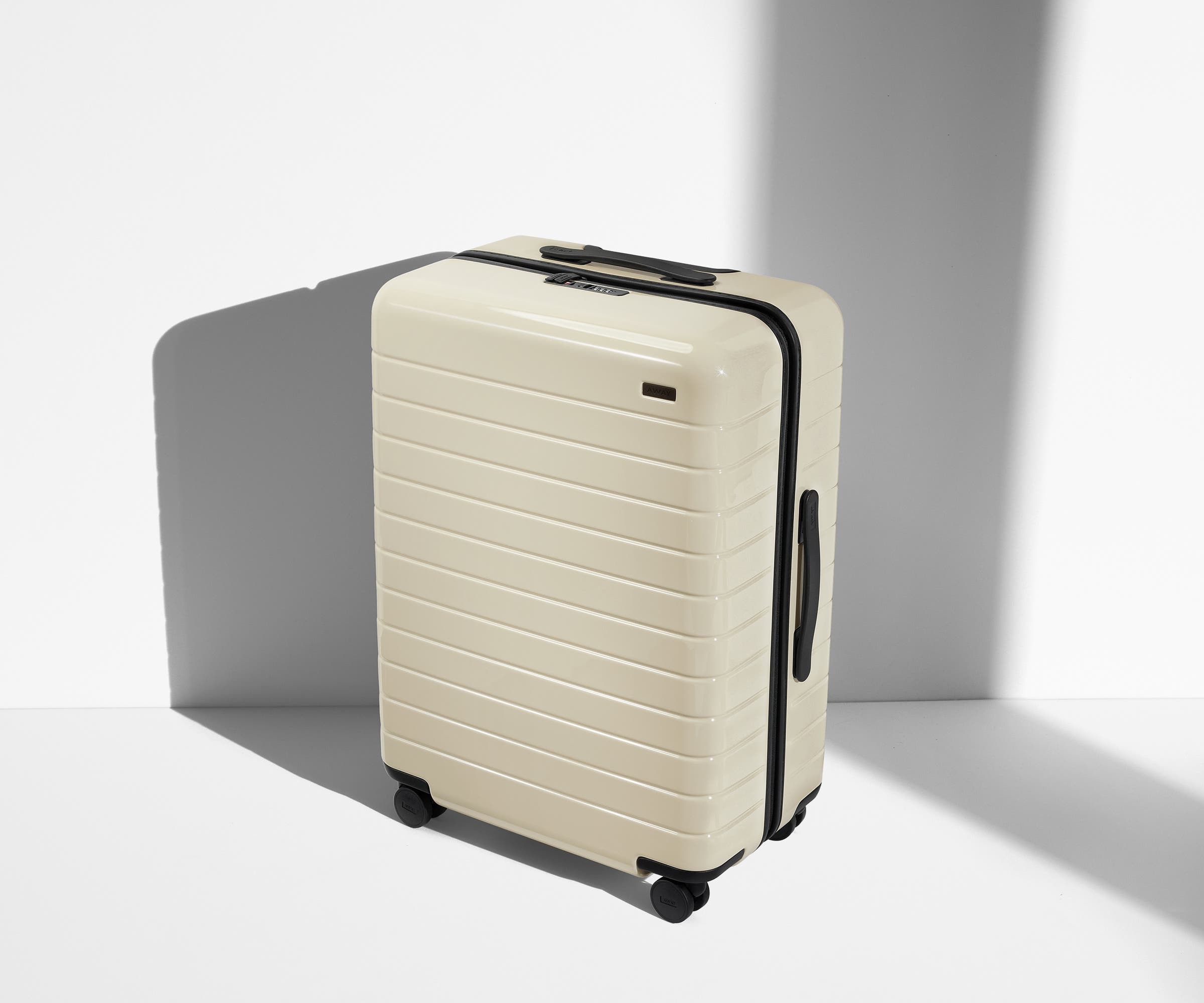 Angled product view of The Medium suitcase in Salt White (Gloss)