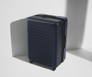 Angled product view of The Large Flex suitcase in Navy Blue