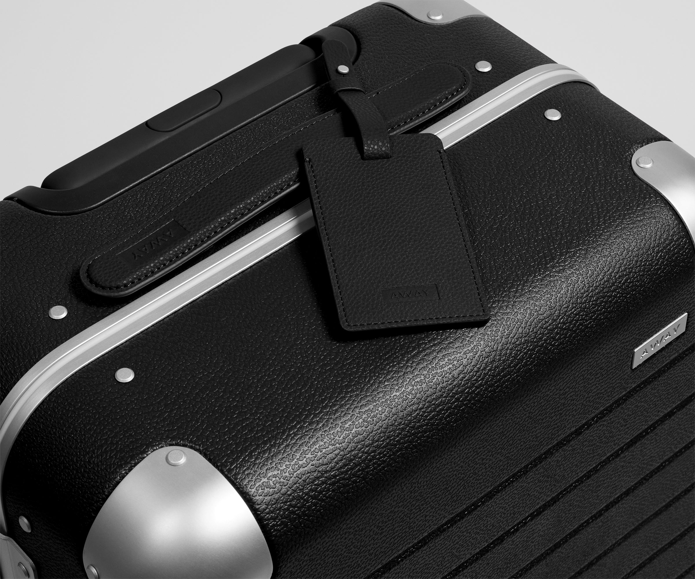 The Aluminum Edge Bigger Carry-On in Jet Black
