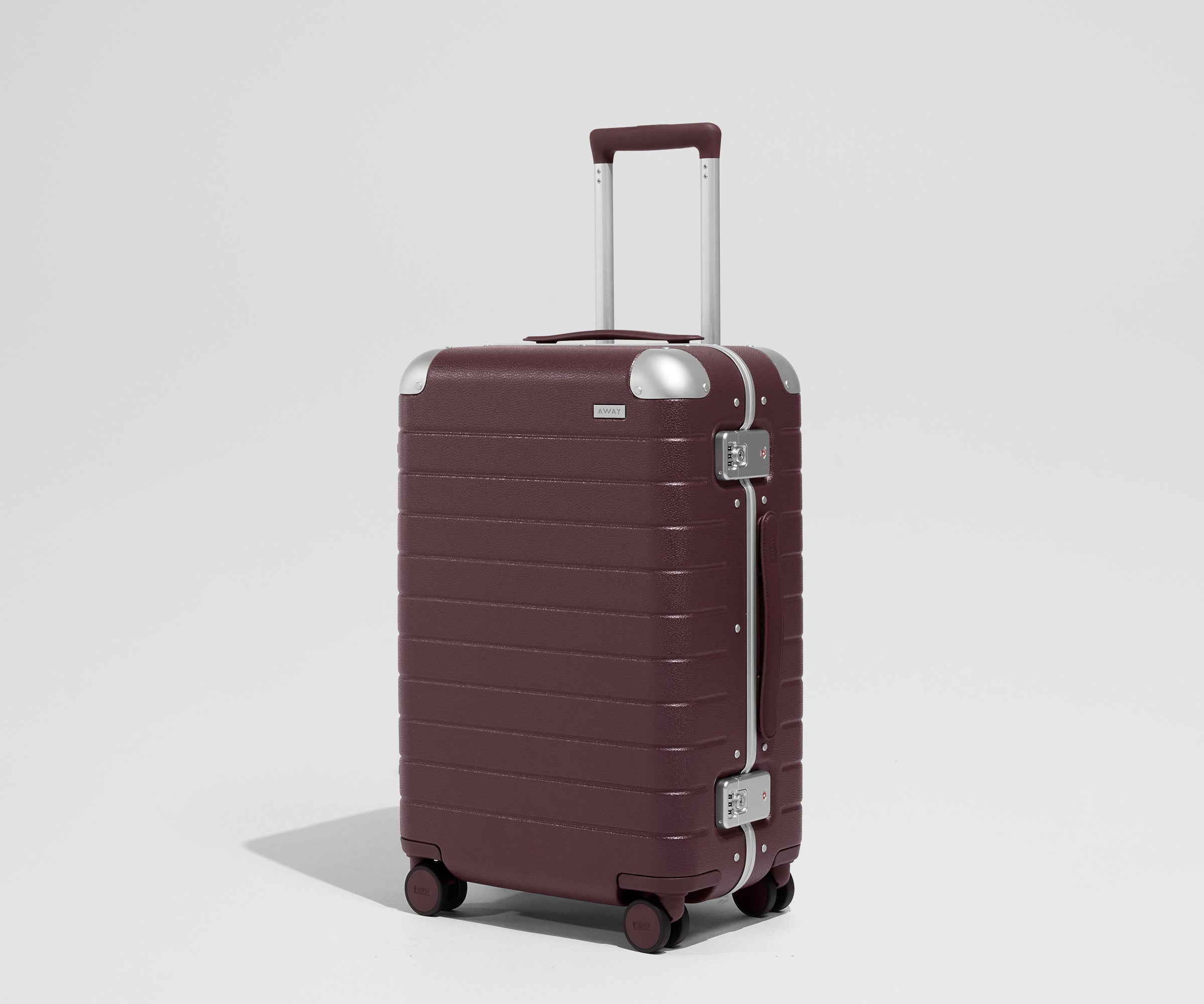 The Aluminum Edge Bigger Carry-On in Oxblood Red