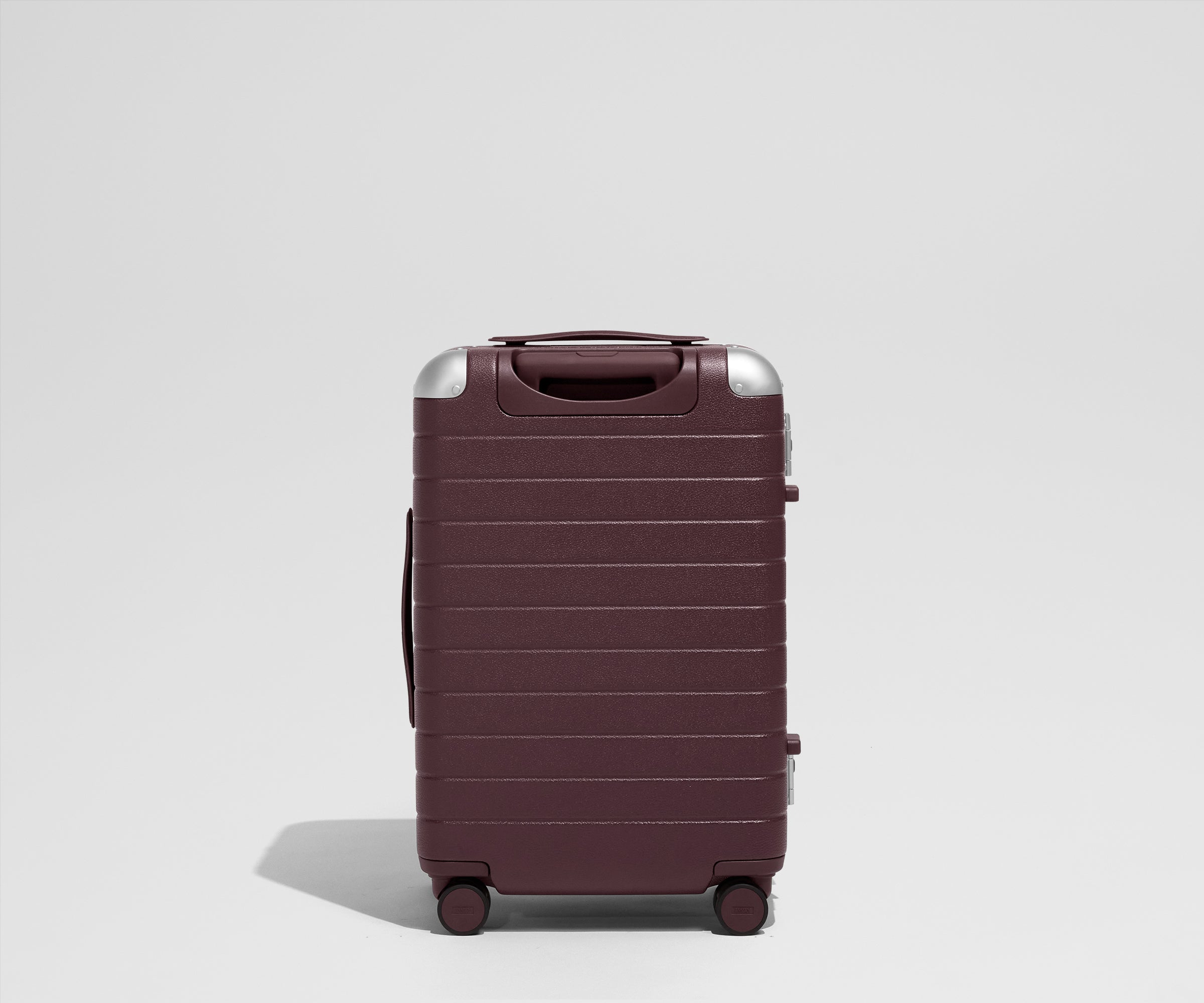 The Aluminum Edge Bigger Carry-On in Oxblood Red