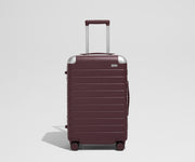 The Aluminum Edge Bigger Carry-On in Oxblood Red