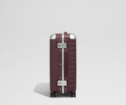 The Aluminum Edge Bigger Carry-On in Oxblood Red