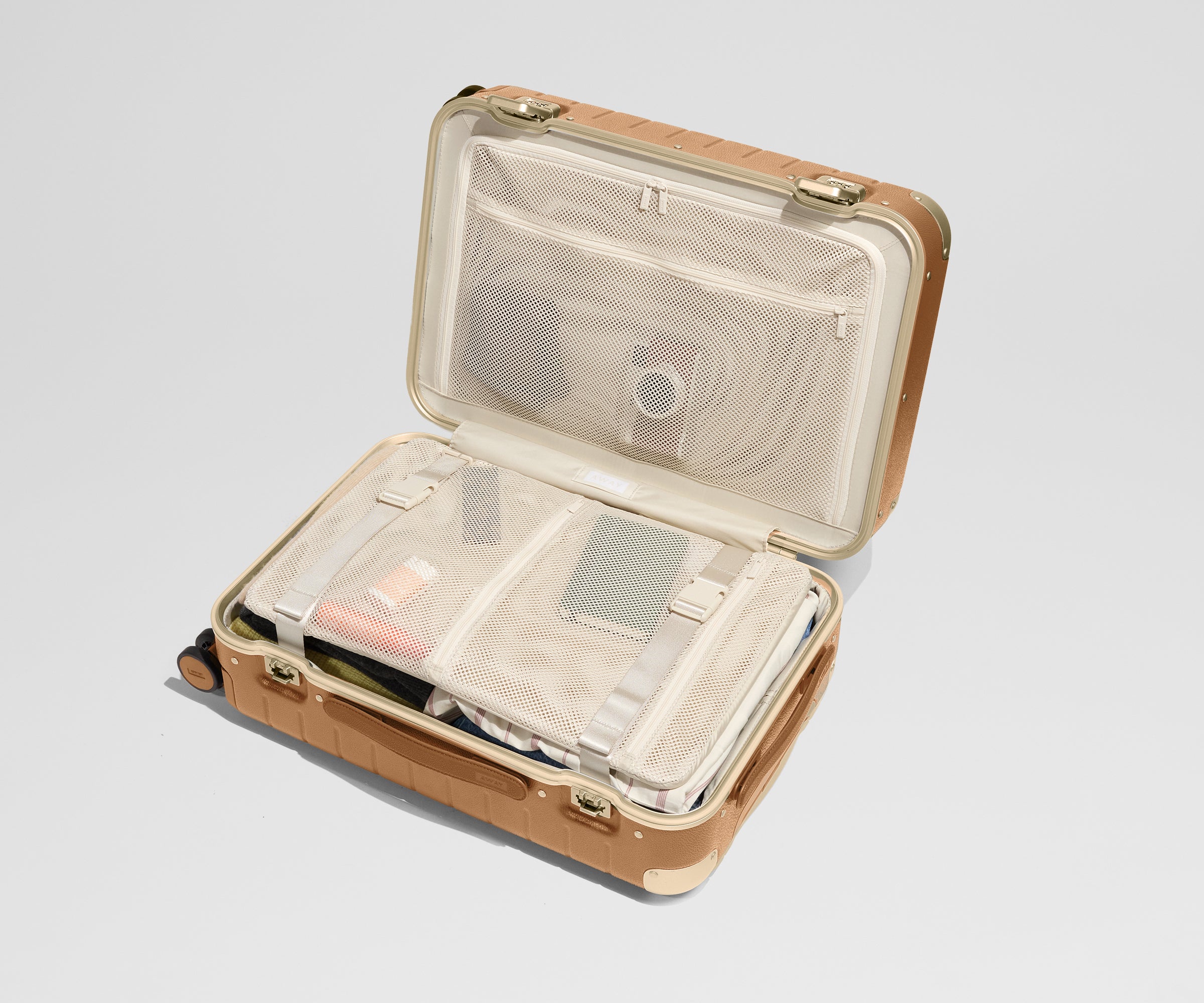 The Aluminum Edge Bigger Carry-On in Cognac Brown