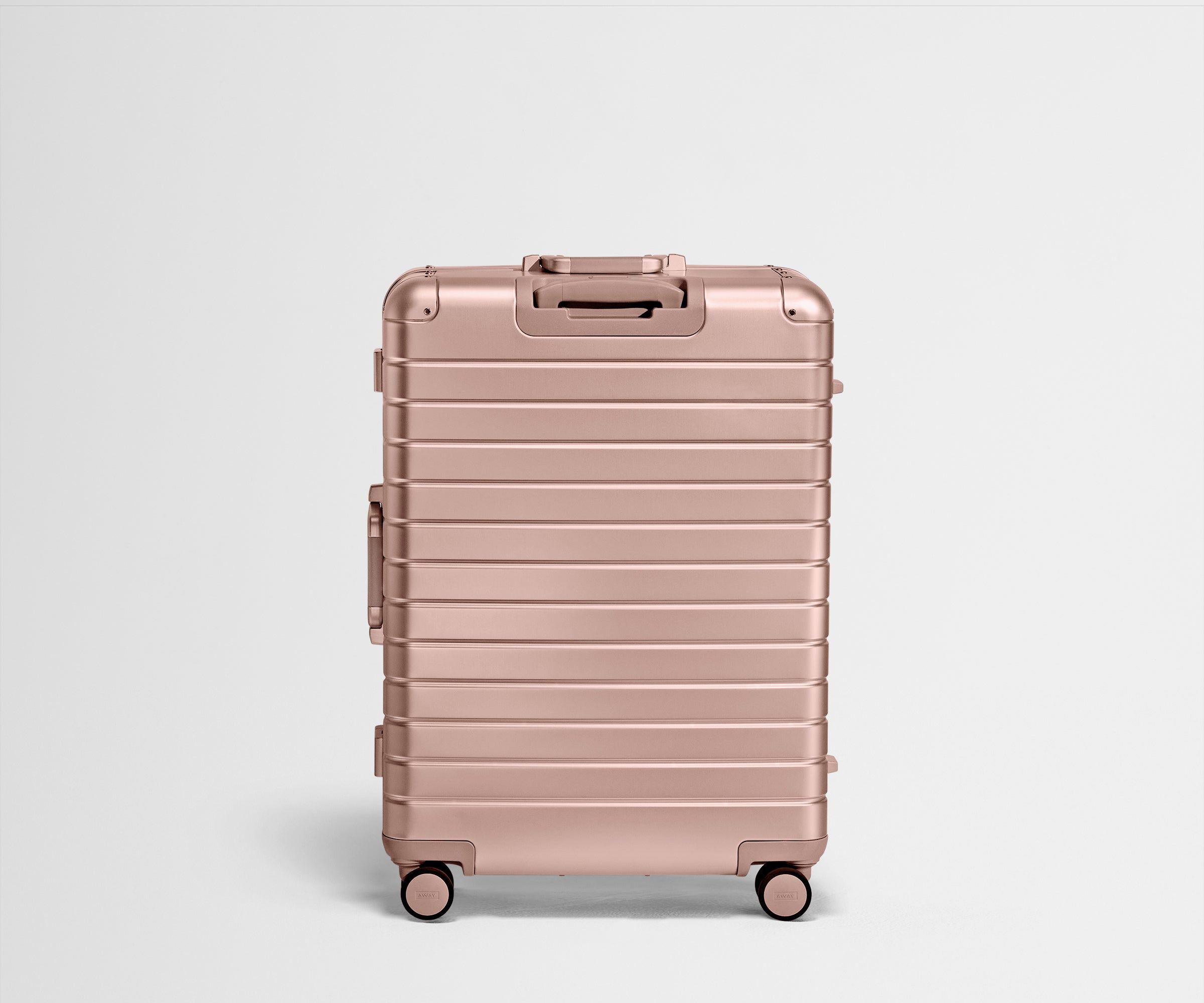 Back view of the Large: Aluminum Edition suitcase in Rose Gold