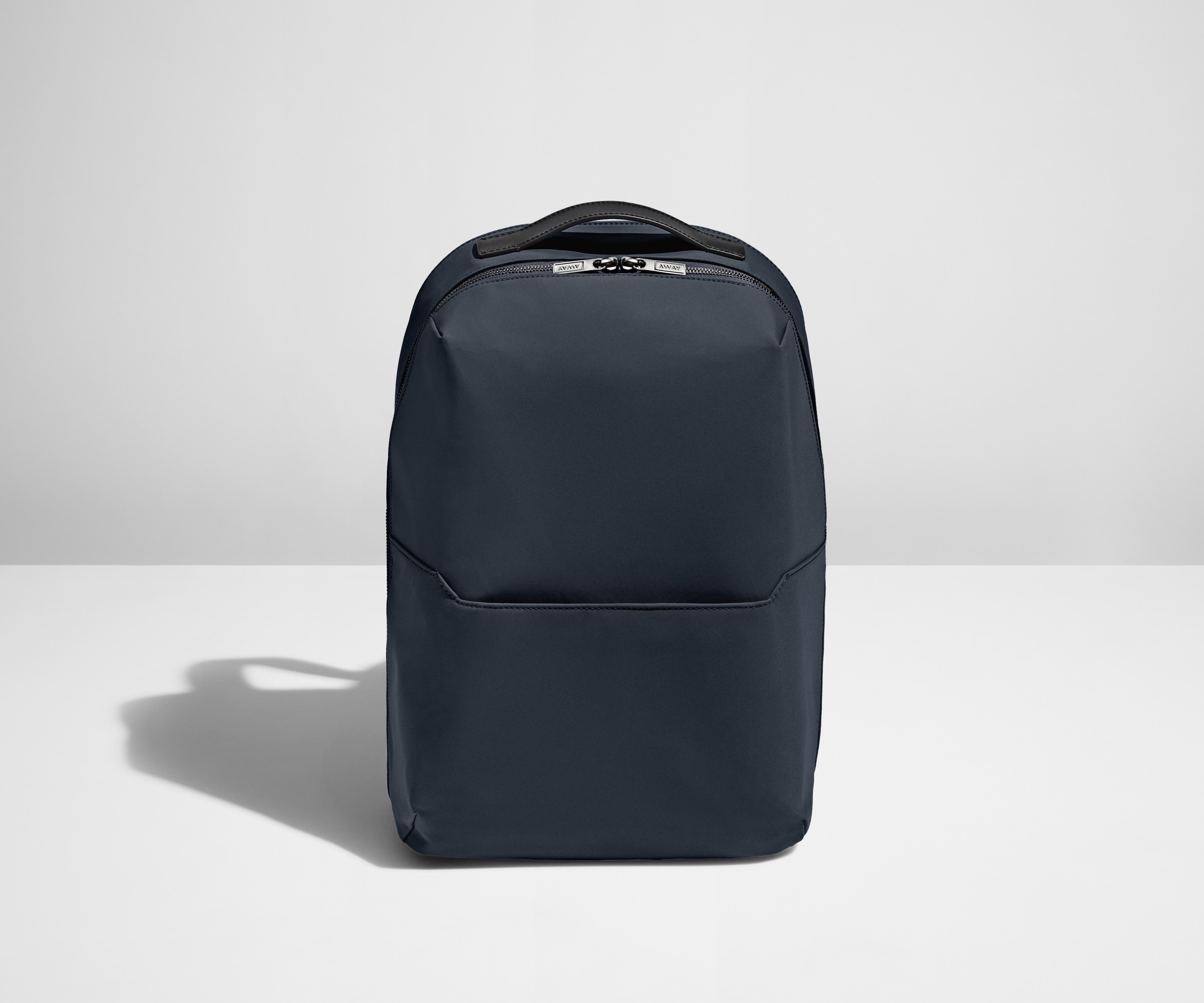 Backpack in Navy with one small pocket in the front.