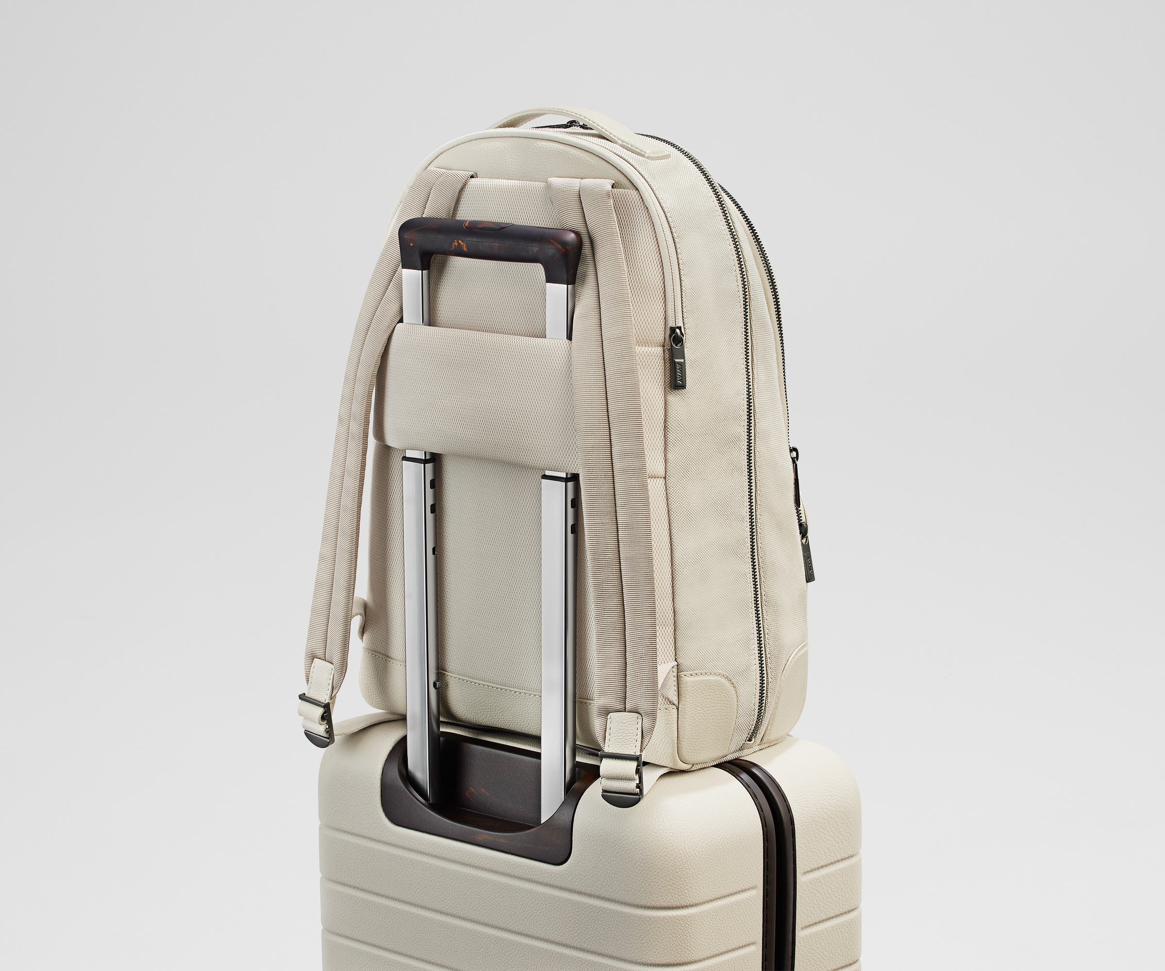 Transit Leather Backpack secured to an suitcase by its padded trolley sleeve
