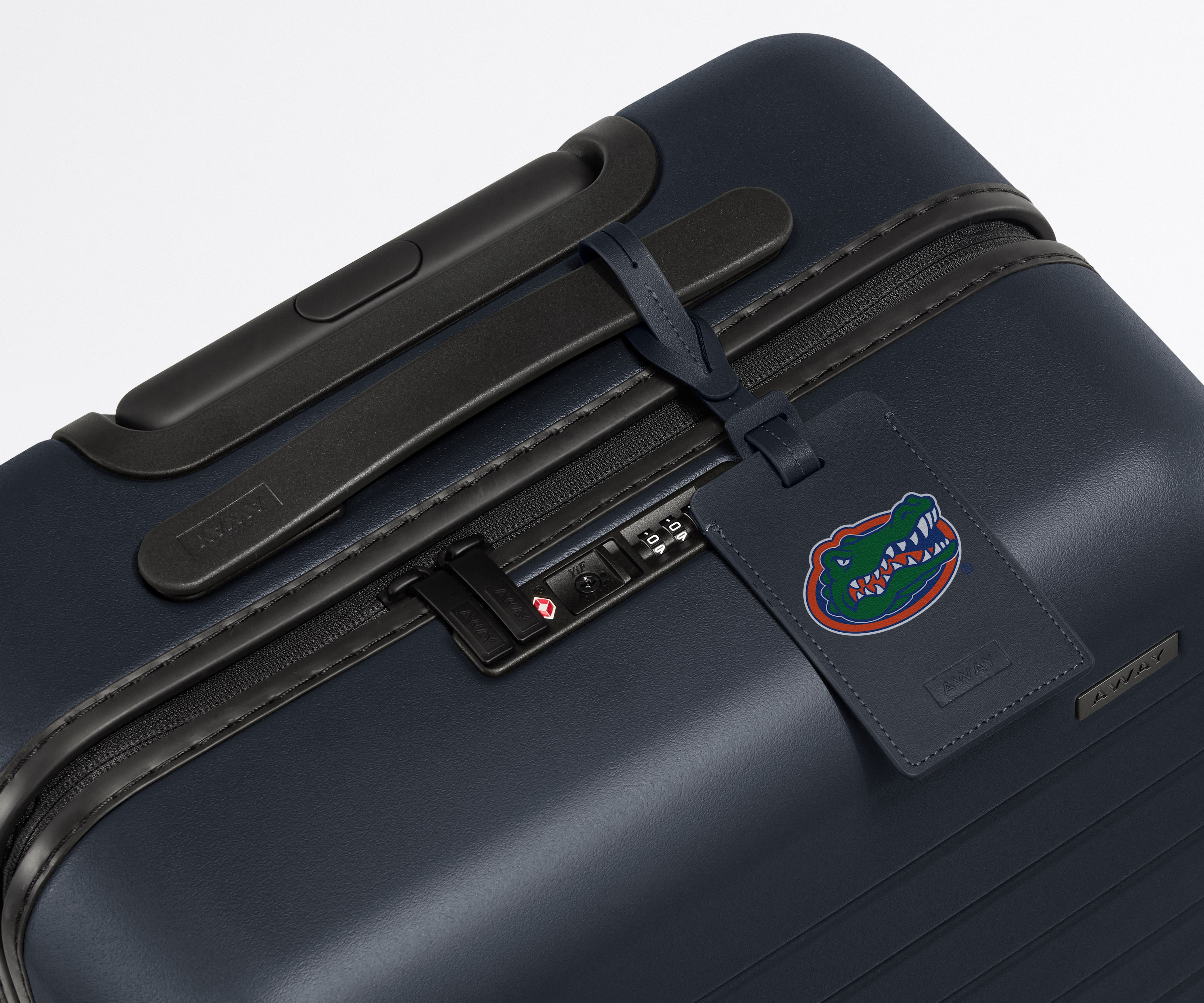University of Florida ® Collegiate Luggage Tag on a Navy Blue Away suitcase