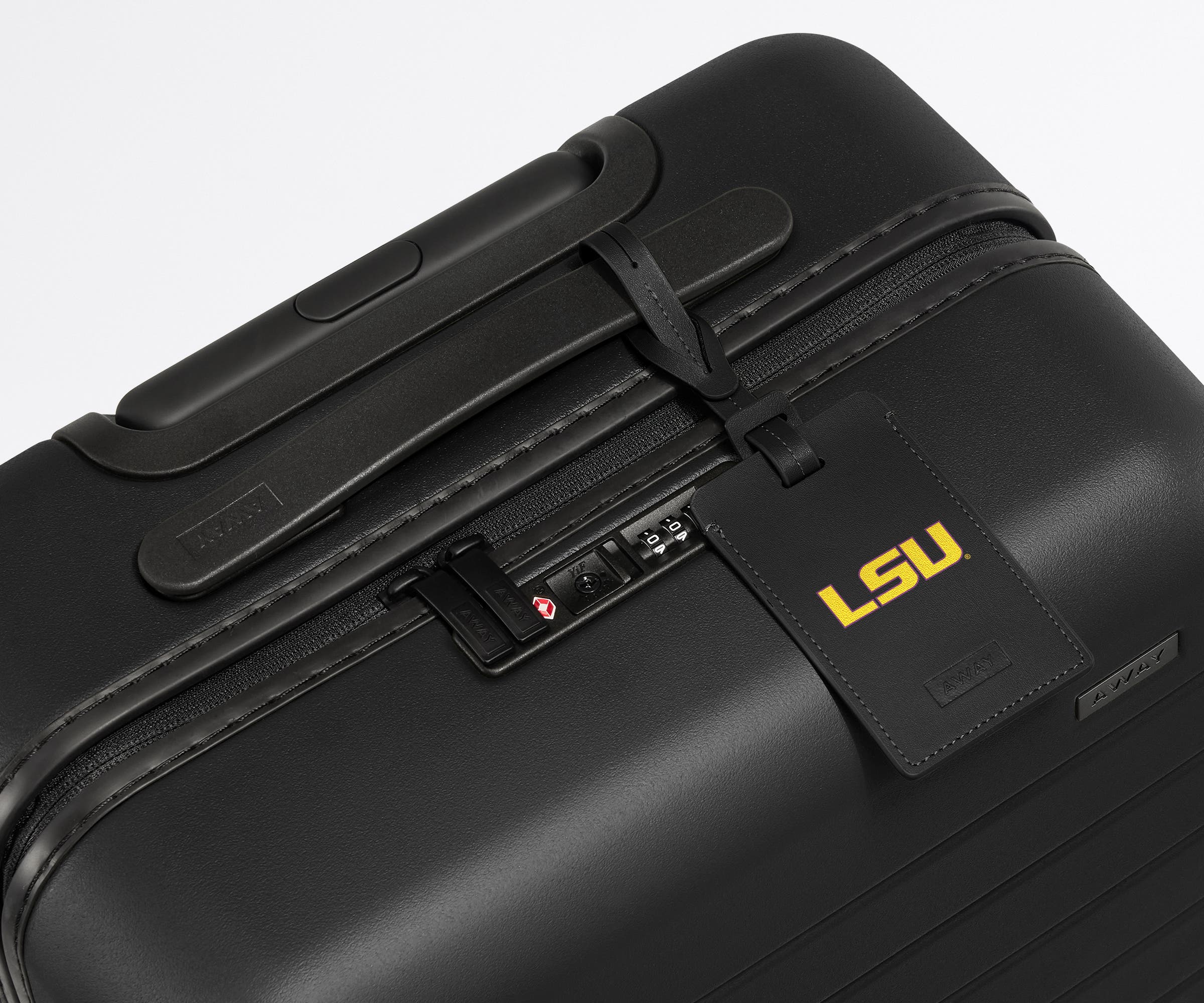 LSU ® Collegiate Luggage Tag on a matching LSU ® Collegiate Bigger Carry-On suitcase