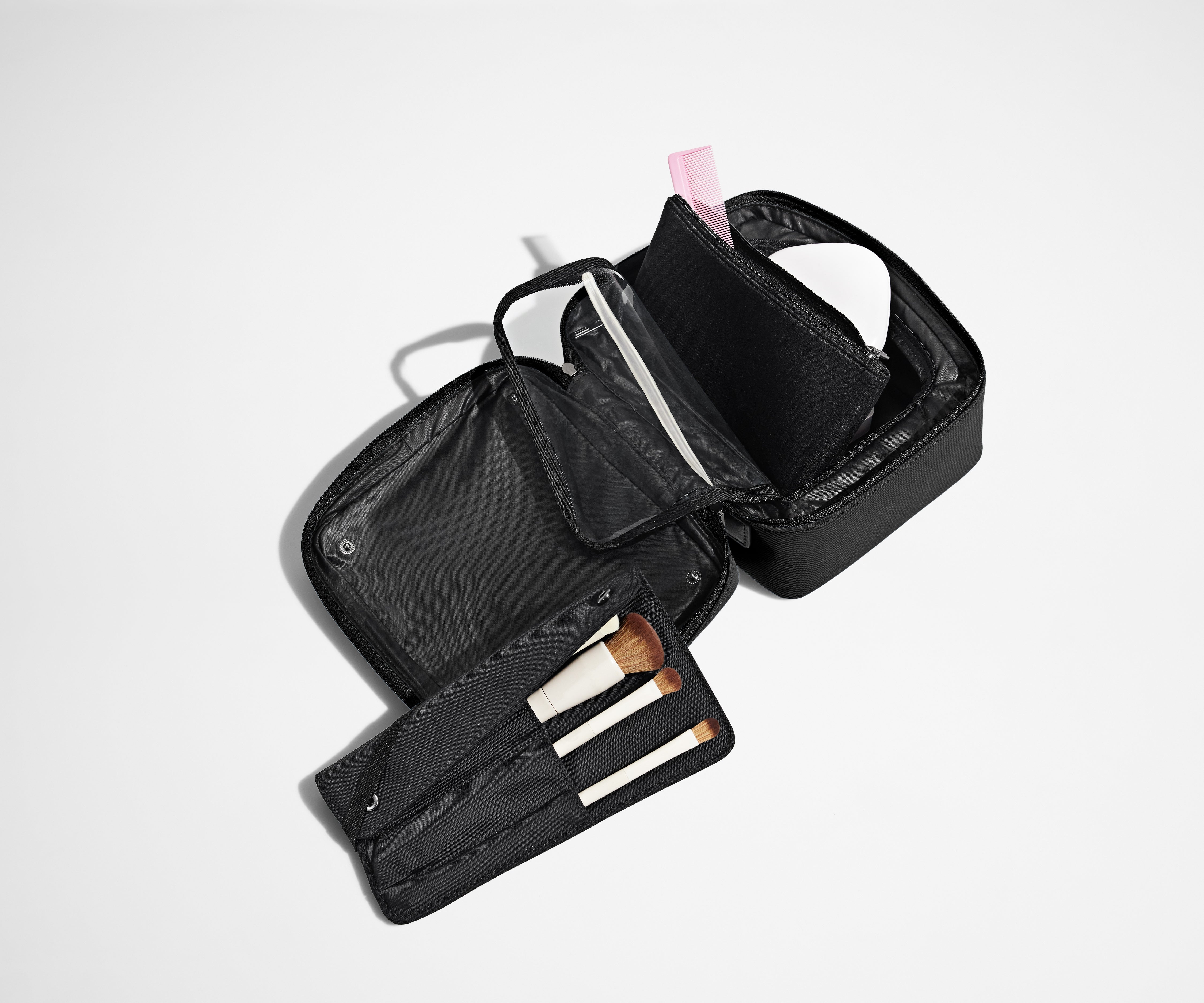 Cosmetics Bag packed with make up and shown with the detachable make up roll