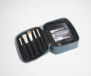 Cosmetics Bag packed with make up brushes and skincare