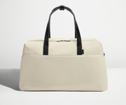 Front view of Away's Weekender duffle in Salt White with handles up
