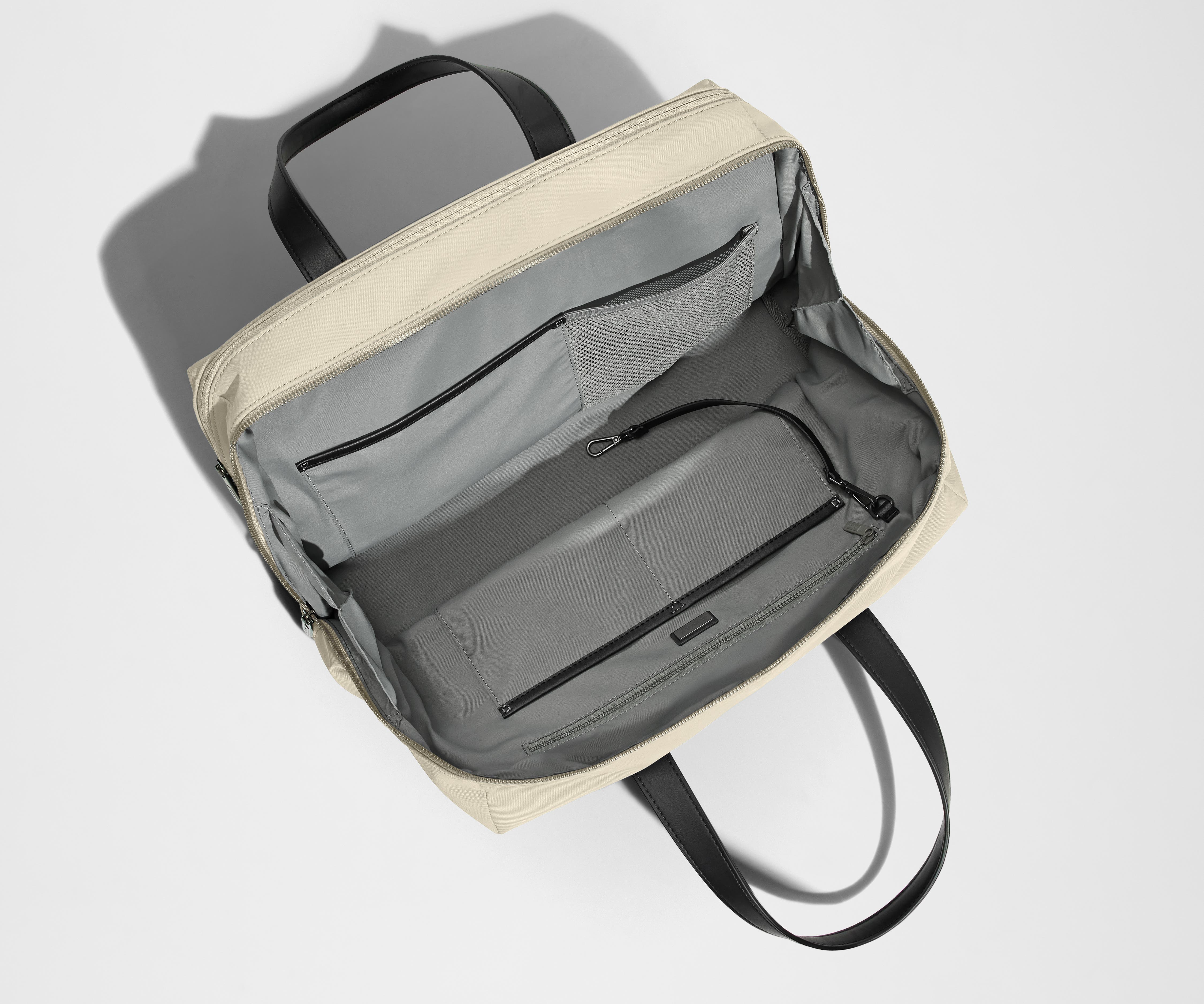 Empty Everywhere Bag, showing the interior organization with multiple slip pockets, zippered pocket, and key leash