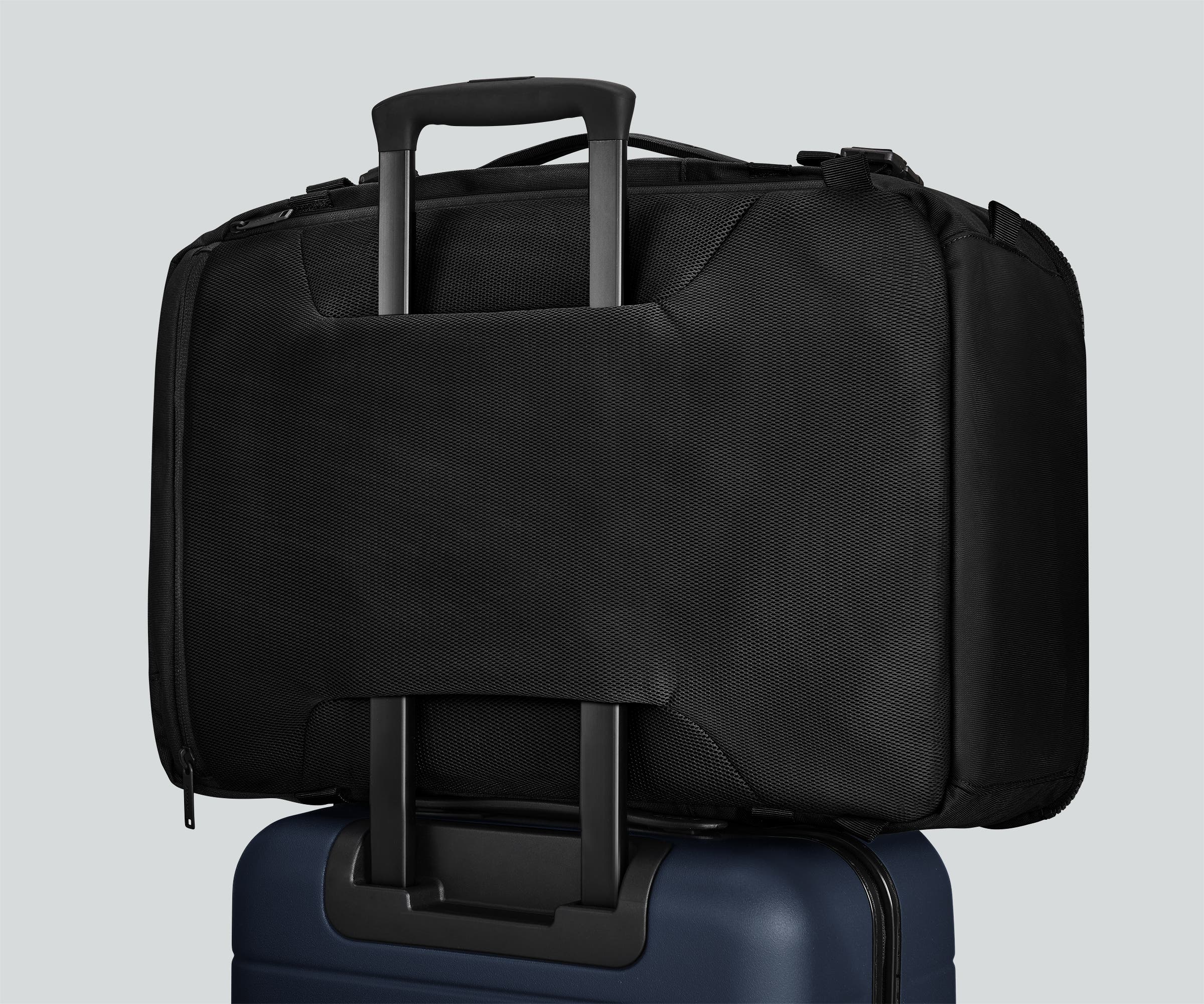 Active Convertible Backpack 45L secured to an Away suitcase by the luggage trolley sleeve