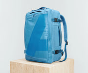 Angled view of the 45L Convertible Backpack, showing the compression straps and side grab handles