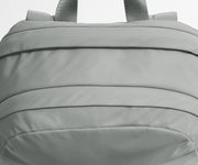 Close-up of a gray backpack with visible stitching details.